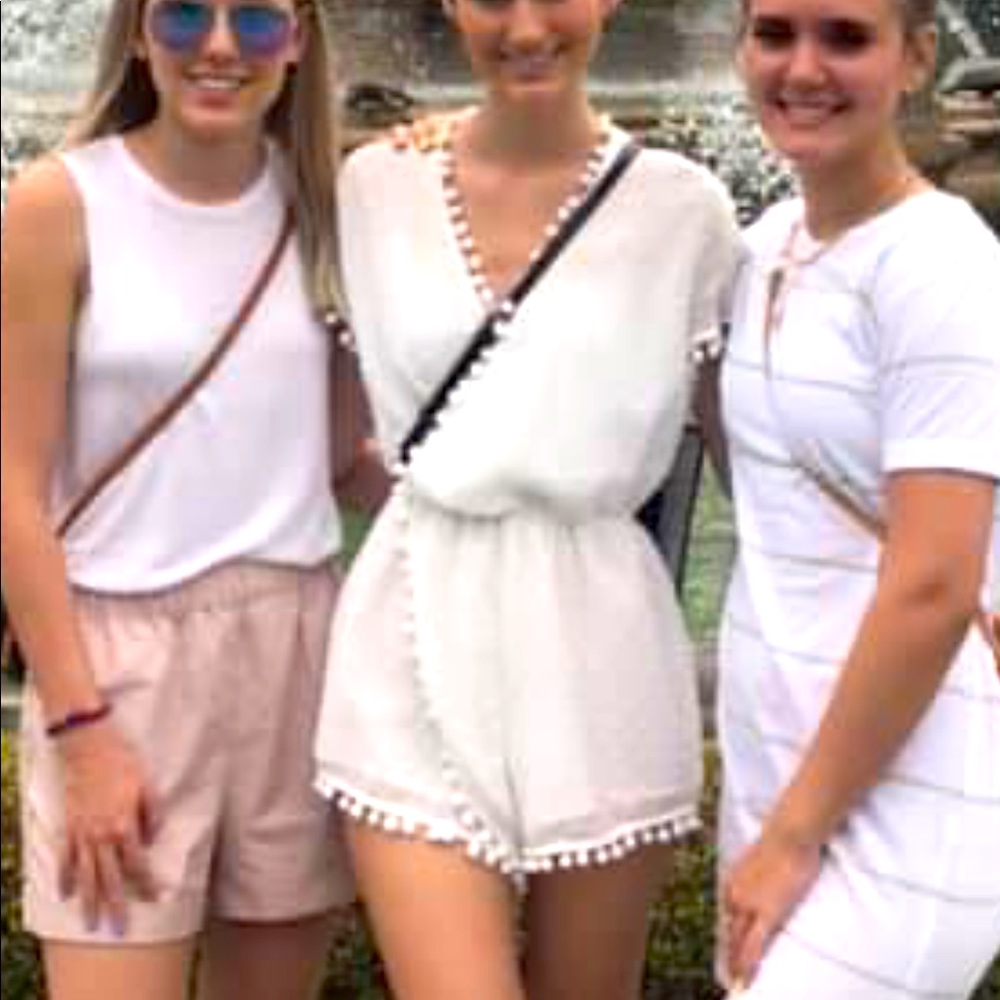 Beautiful white romper w/ pom pome